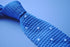 light blue skinny knitted tie with white polka dots